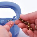 Outil pour faire des noeuds de table Knot a bead