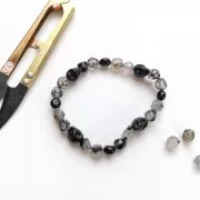 Perle tête de mort 8x6 mm imitation Howlite teintée - Bleu foncé x1