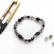 Perle tête de mort 10x8 mm imitation Howlite teintée - Turquoise x1