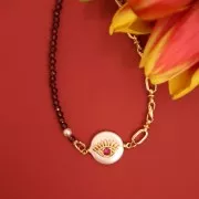 Intercalaire rond perle d'eau douce et main de Fatma en oxydes de Zirconium 12 mm - Doré x1