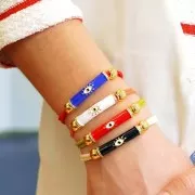 Perle tube incurvé en résine époxy & oxydes de Zirconium 33x8 mm motif oeil - Doré - Rouge x1