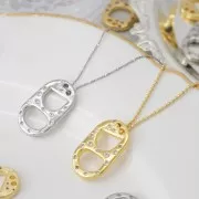 Pendentif double trous languette de capsule 20x12 mm avec oxydes de Zirconium - Doré x1