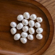 Perle d'eau douce ovale irrégulière 11x10 mm - Grade A Blanc x1
