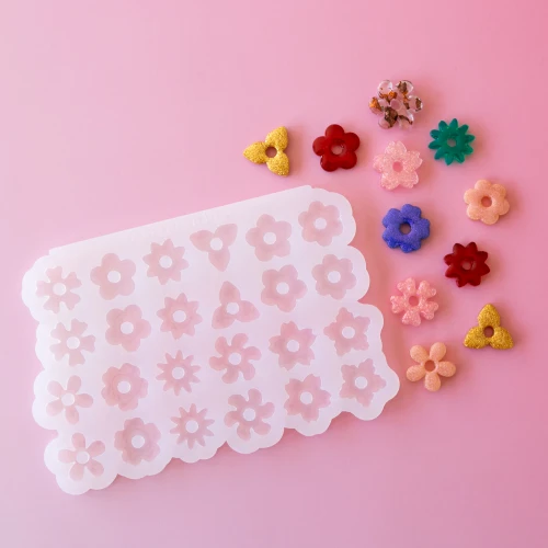 Moule en silicone Géa Creations pour réaliser des pendentifs mix de fleur 2 x1