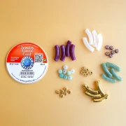 Mes bijoux DIY - Kit de 4 bracelets élastiques avec perles tubes - Version Doré