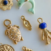 Breloque main 15x5.5 mm motif oeil et strass - Acier inoxydable 304 Doré x1