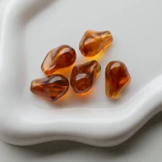 Perles irrégulières 21x15 mm en résine transparente - Ambre marbré x10