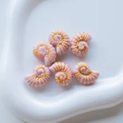 Perle coquillage escargot 21.5x16.5 mm en céramique - Rose - Doré x1