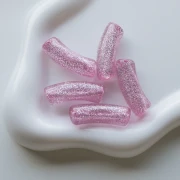 Perles tube incurvé 35x11 mm en acrylique transparente - Rose Pailleté Argenté x6