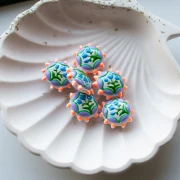 Perle ronde aplatie 20 mm en verre - motif fleur - Violet - Orange fluo - Bleu x1