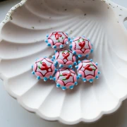 Perle ronde aplatie 20 mm en verre - motif piment - Rose - Bleu ciel - Rouge x1