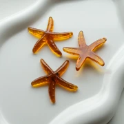 Pendentif étoile de mer 37x38 mm en résine - Caramel x1