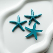 Pendentif étoile de mer 37x38 mm en résine - Bleu turquoise - Noir marbré x1
