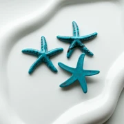 Pendentif étoile de mer 37x38 mm en résine - Bleu turquoise - Noir marbré x1