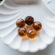 Perles rondes irrégulières facettées en résine 16 mm Topaz marbré x1