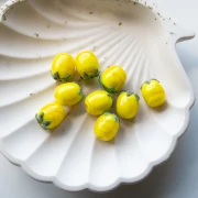 Perle citron 13x11 mm en verre - Jaune - Vert feuille x1