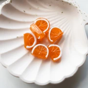 Perle tranche d'orange 18.5x13 mm en verre - Orange - Blanc x1