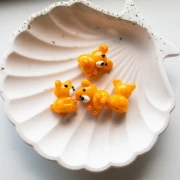 Perle ourson 19x14 mm en verre - Orange marbré x1