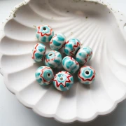 Perle rondelle 15x10.5 mm en céramique - Turquoise - Rouge x1