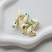 Perle oiseau 15x21 mm en céramique - Beige - Turquoise x1