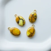 Breloque ovale 18x11 mm en pierre gemme - Turquoise Oyster Jaune x1