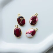 Breloque ovale 18x11 mm en pierre gemme - Turquoise Oyster Rouge x1