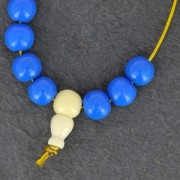 Perle gourou trois trous 8mm pour fabriquer un Mala Tibétain Imitation Howlite x1