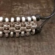 Composant avec une rondelle 12 mm pour des lacets de 1.5 mm Doré à l'or fin x1