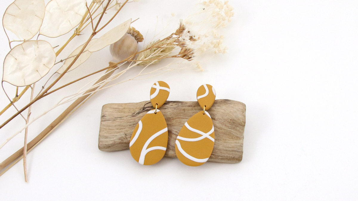 Schéma Bijoux en pâte polymère au motif graphique fait de fils en Fimo Schéma Bijoux en pâte polymère au motif graphique fait de fils en Fimo