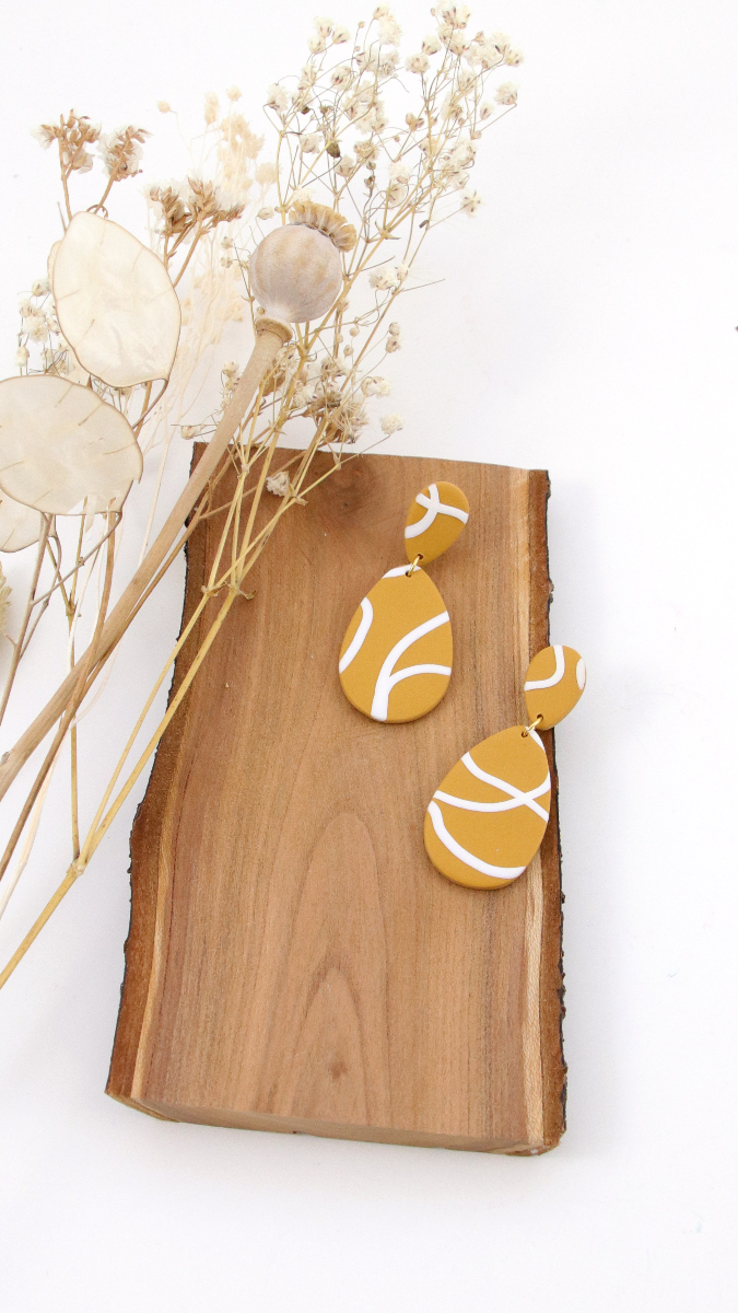 Schéma Bijoux en pâte polymère au motif graphique fait de fils en Fimo Schéma Bijoux en pâte polymère au motif graphique fait de fils en Fimo