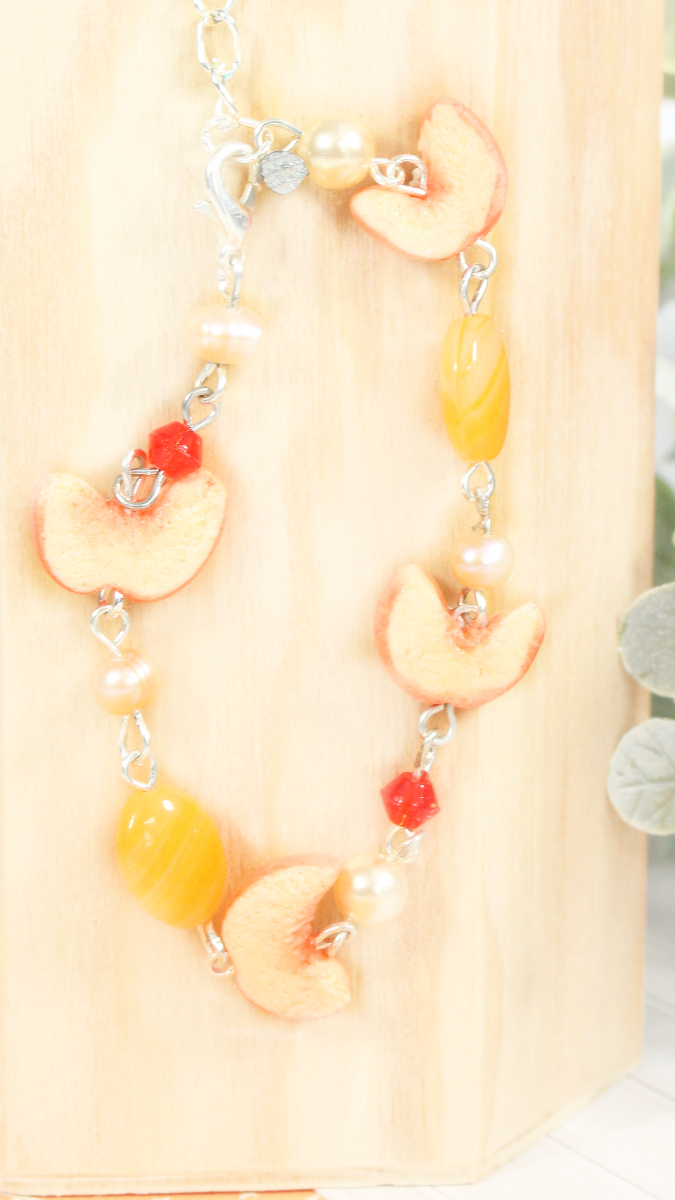 Schéma Bracelet pêle-mêle de perles et tranches de pêche en pâte polymère